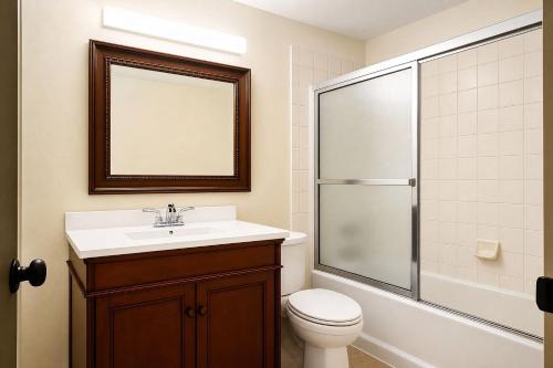 a bathroom with a toilet and a sink and a shower at VAIL MOUNTAIN SUITE in Vail