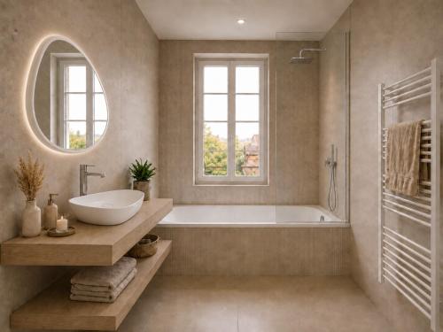 a bathroom with a tub and a sink and a mirror at Château Alto Cormeil in Saint-Émilion