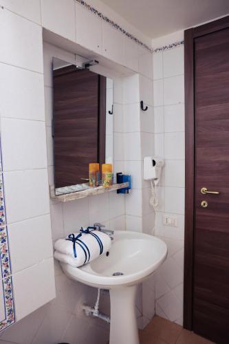 a bathroom with a sink and a mirror at Western Termini Guest House in Rome