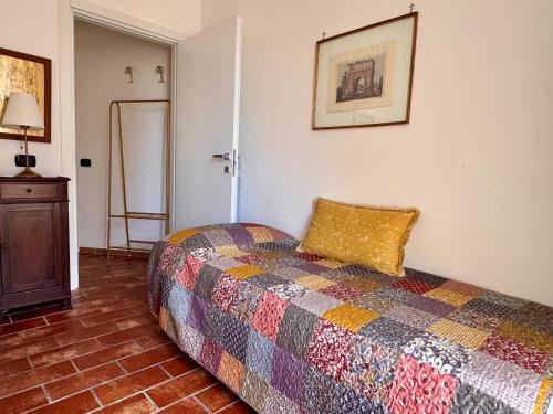 a bedroom with a bed with a pillow on it at B&B La Meta in Benevento
