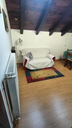 a bedroom with a bed and a desk with a keyboard at B&B Sella Klancic in San Pietro al Natisone
