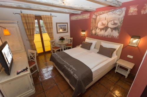 Giường trong phòng chung tại 4-Sterne Erlebnishotel El Andaluz, Europa-Park Freizeitpark & Erlebnis-Resort