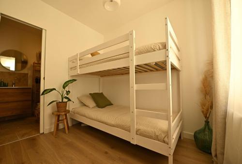 a white bunk bed in a room at Le Cocon de Pommard in Pommard