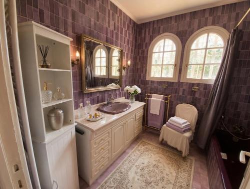 a bathroom with a sink and a mirror at Villa Daurus in Vallauris