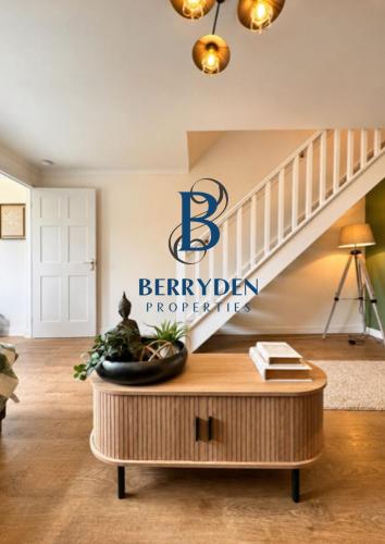 a living room with a berkeley pharmacy sign on the wall at Restmore House in Inverugie Mill