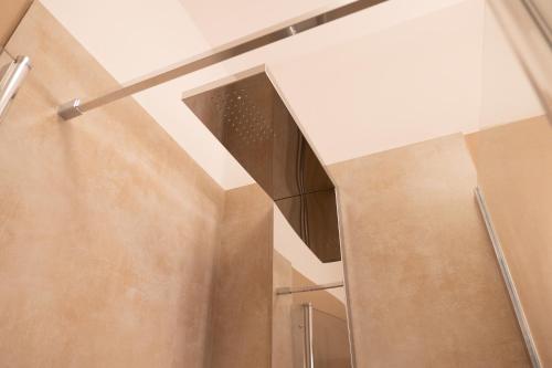 a staircase in a building with a glass wall at Casa Pescoluse 50m dal Mare in Marina di Pescoluse