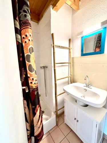 a bathroom with a sink and a shower at Maison proche vallon pont d arc in Salavas