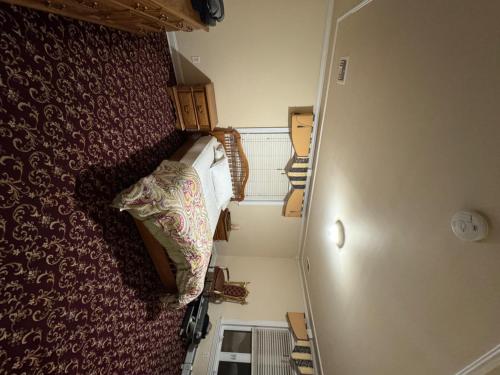 an overhead view of a small room with a bed at Regal Haven in Metuchen