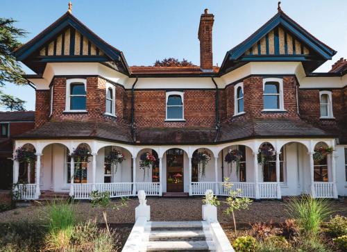 an old brick house with a turret at CIM Business Centre in Maidenhead