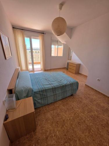 a bedroom with a bed and a staircase at Durino apartment with terrace in Moncófar