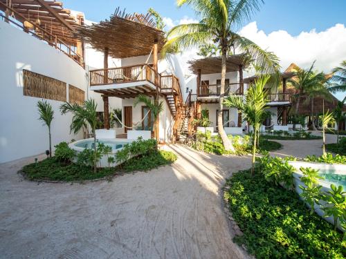 an exterior view of a resort at Villas HM Palapas del Mar in Holbox Island