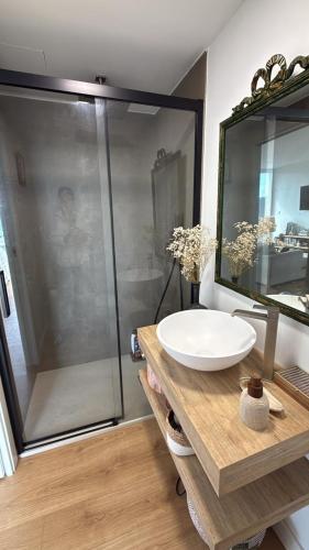 a bathroom with a sink and a shower at Casa Broullón in Moaña