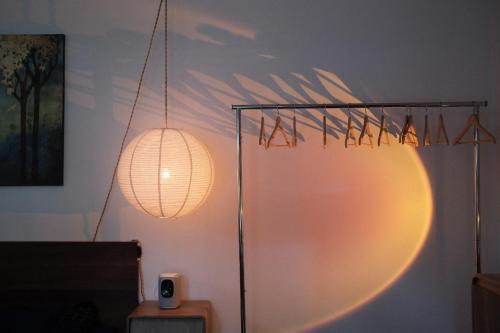 a light fixture in a room with a wall at Belmont Station in Belmont