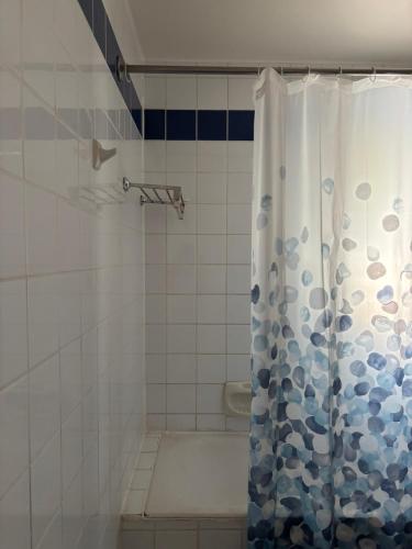 a bathroom with a shower with a shower curtain at dana beach resort in Half Moon Bay