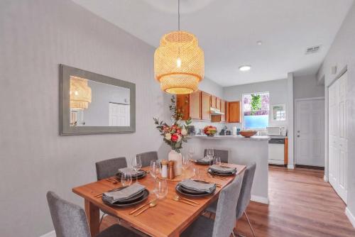 a dining room with a wooden table and chairs at The Prairie at Brighton - UF , Pool , Workspace in Gainesville