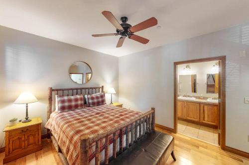a bedroom with a bed and a ceiling fan at Blue River Bliss in Silverthorne