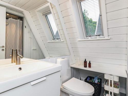 a bathroom with a sink and a toilet at 4 star holiday home in Farsø in Farsø