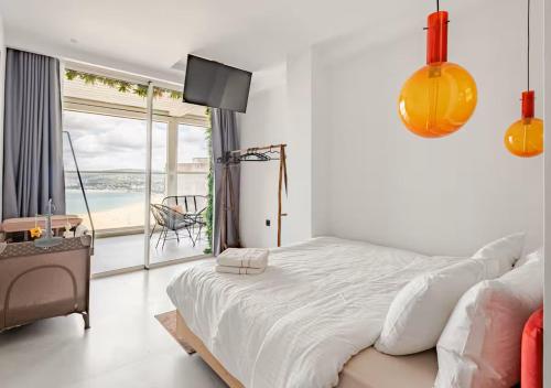 a bedroom with a bed and a view of the ocean at The blue Mirage II in Tangier
