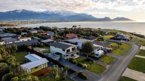 an aerial view of a small town next to the water at The Lookout, Spacious, Stunning Views - KK12632 in Kaikoura