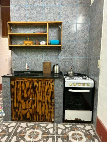 a kitchen with a stove and a counter top at Monoambiente LPS in Santiago del Estero