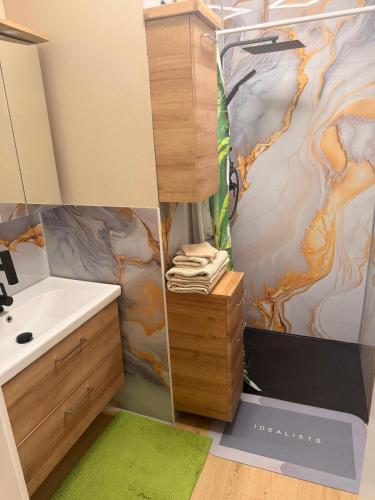 a bathroom with a sink and a mirror at Privatroom for rent in Bad Fischau