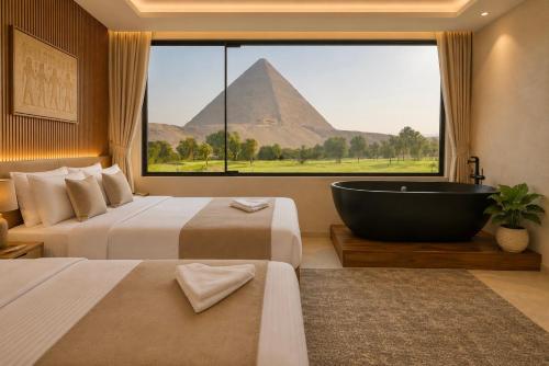a hotel room with a view of the pyramids at Vincci Pyramids View in Cairo