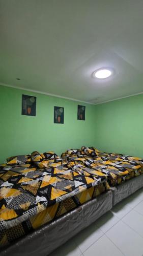 a large bed in a room with at Villa Arkhazio in Megamendung