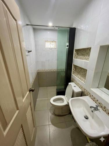 a bathroom with a toilet and a sink at BP Private Home in Ban Nong Sa