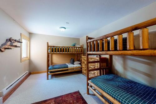 a room with two bunk beds and a bed at San Juan Siesta in South Fork