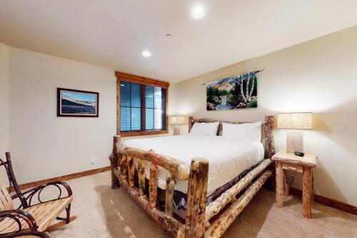 a bedroom with a large bed with a wooden frame at The Lodges 1145 in Mammoth Lakes