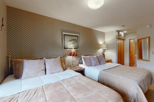 a hotel room with two beds in a room at Okemo Mountain Condo in Ludlow