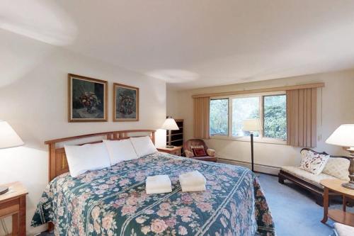 a hotel room with a bed and a couch at Mountainside Resort: K105 in Stowe
