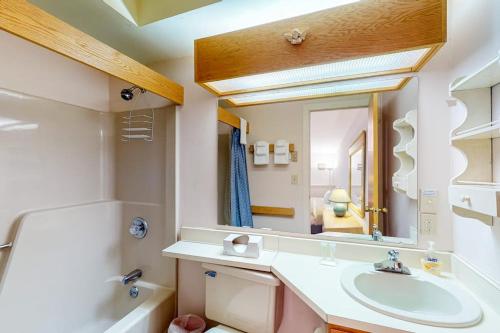 a bathroom with a sink and a mirror at Vermont Paradise in Warren