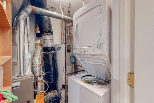 a utility room with a washer and a washing machine at Winterplace Condos H in Ludlow