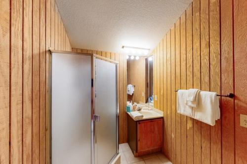 a bathroom with a shower and a sink at Mountainside 037 in Granby