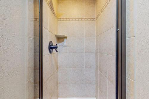 a shower with a glass door in a bathroom at Lodgepole Landing in Silverthorne