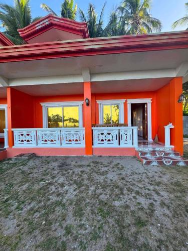 a house with an orange at Tellos Beach House in Siquijor