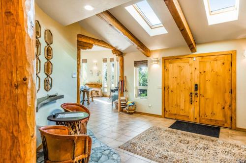 a bathroom with a tub and a table and chairs at Pagosa Peak View in Pagosa Springs