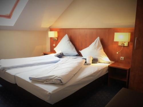 Ένα ή περισσότερα κρεβάτια σε δωμάτιο στο Hotel - Restaurant Braustube
