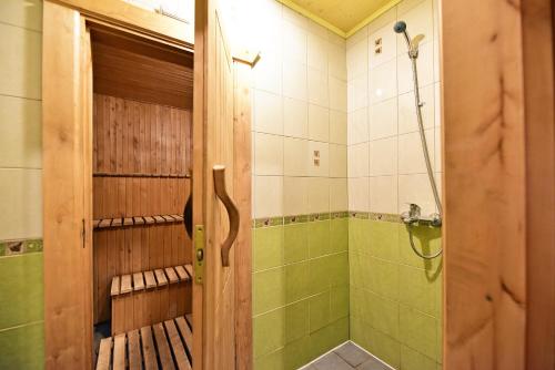 a bathroom with a shower and a toilet and a shower at Ežero Panorama in Skirlėnai