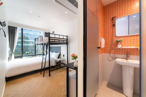 a bedroom with a bunk bed and a sink at Hotel LETS POP in Seoul