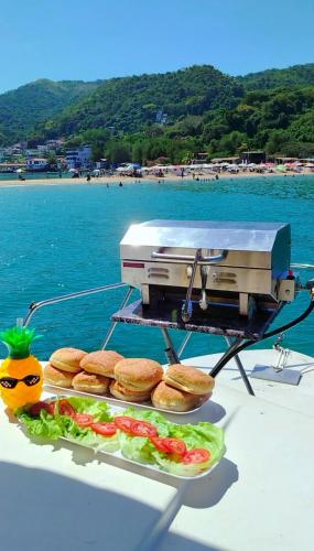 a grill on the back of a boat with food at Tour Full Day Taboga in Panama City