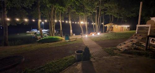 a park at night with a playground and lights at Houseboat - Hotel Ukiel Wellness & SPA in Olsztyn