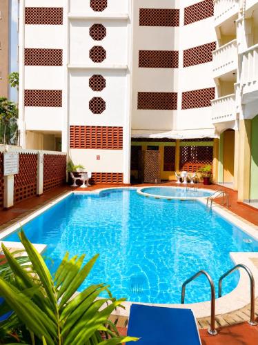 a swimming pool in the middle of a building at Raya hotel Nyali Mombasa in Mombasa