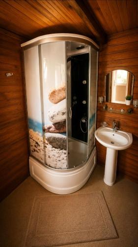 a bathroom with a shower and a sink at Cirali Camping in Cıralı
