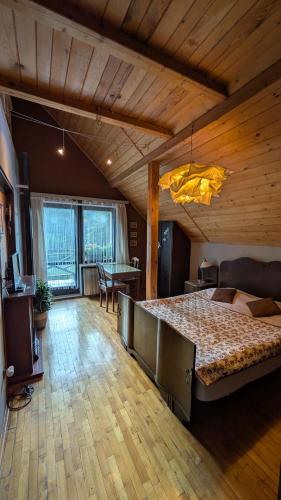 a bedroom with a large bed in a room at Agroturystyka SPA in Zelków