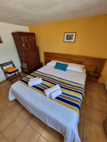 a bedroom with a large bed in a room at Casa Cami in Jurilovca