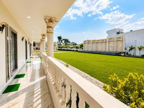 a view from the balcony of a house with a lawn at Hotel SR Vivanta,Brahmapur in Brahmapur