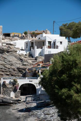 a group of white buildings on a rocky hill at Aegean Whisper Koumelas in Mamádhos