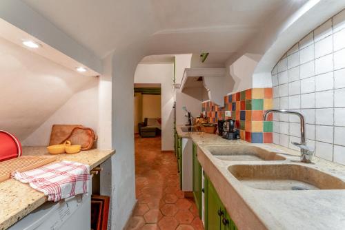 a kitchen with two sinks in a room at Amour de Provence in Nyons